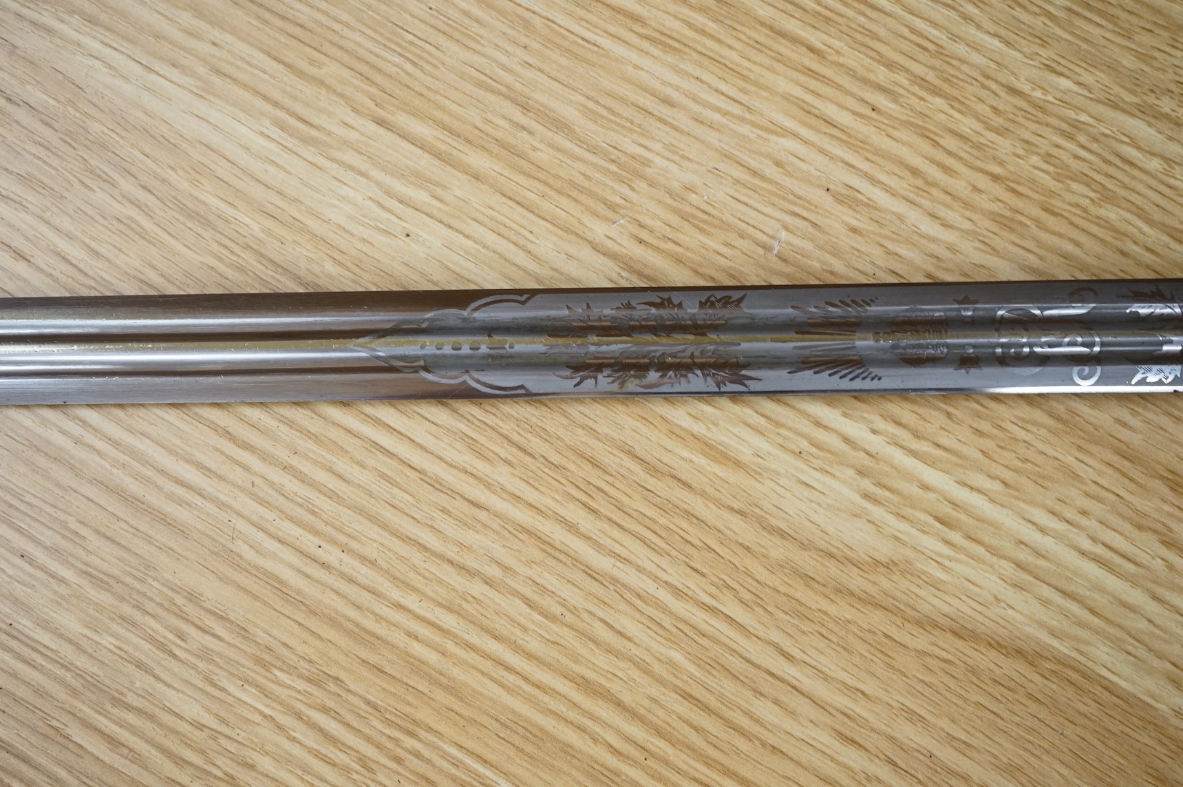 World War I Scottish infantry officer’s undress sword, etched and polished regulation blade with crowned GVR cipher and regulation cruciform hilt, in its steel scabbard